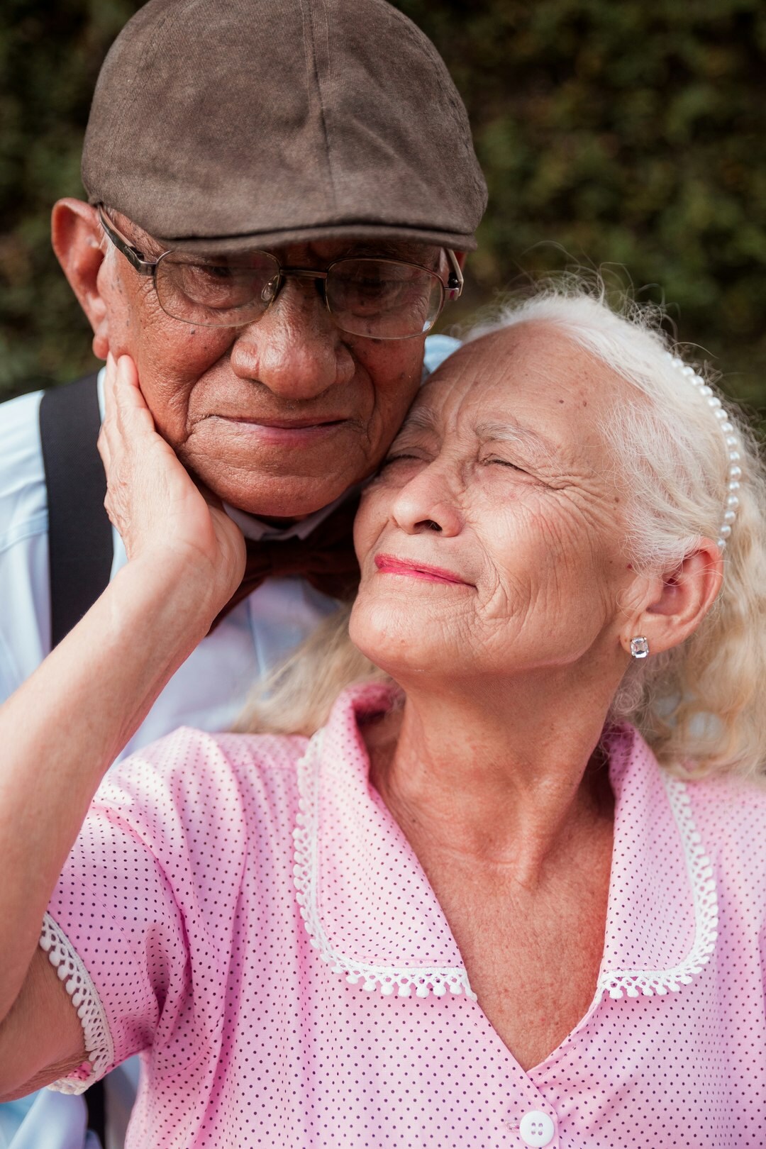 elderly friends embracing
