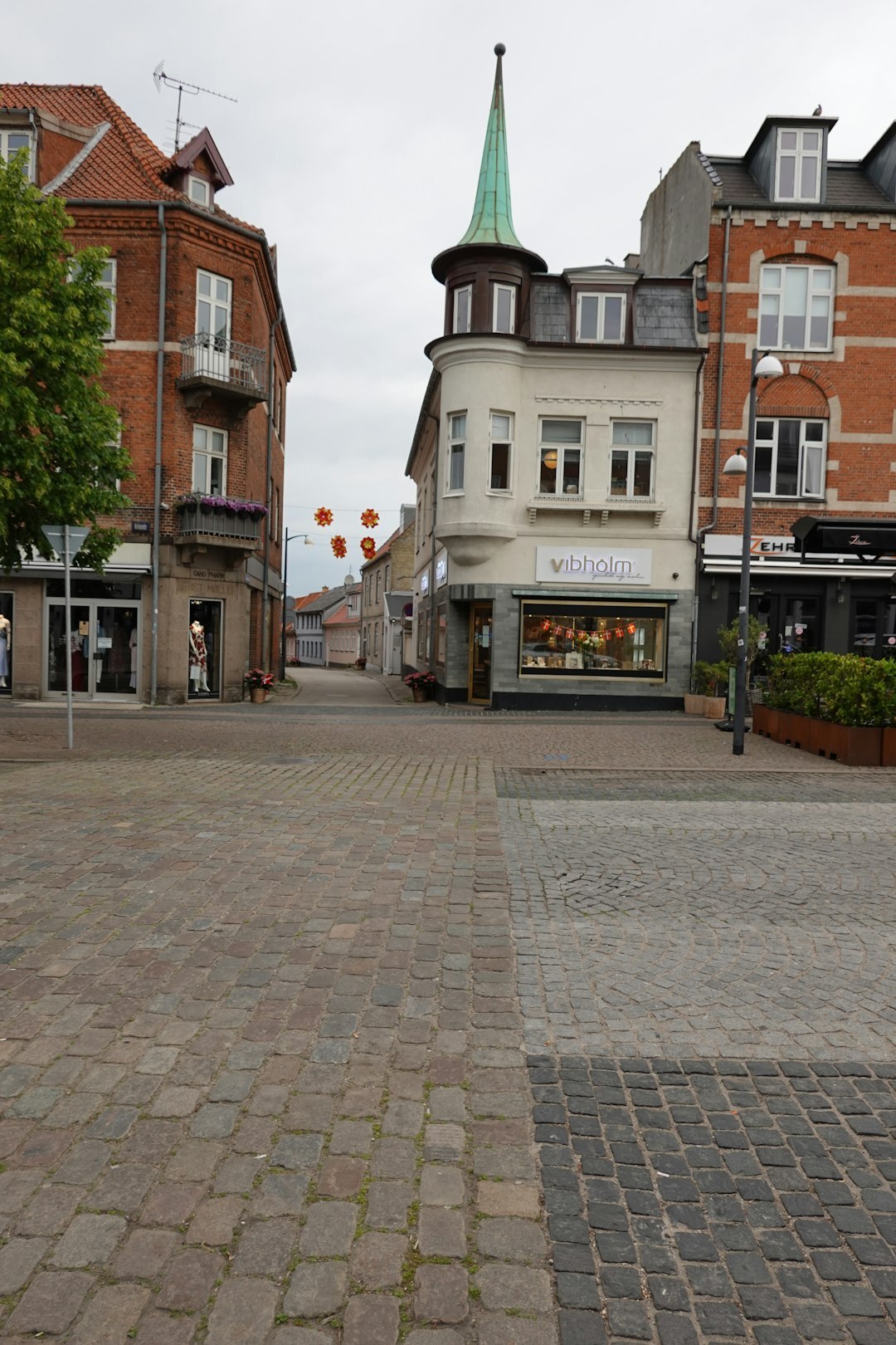 Outdoor market stalls in a small Danish town square