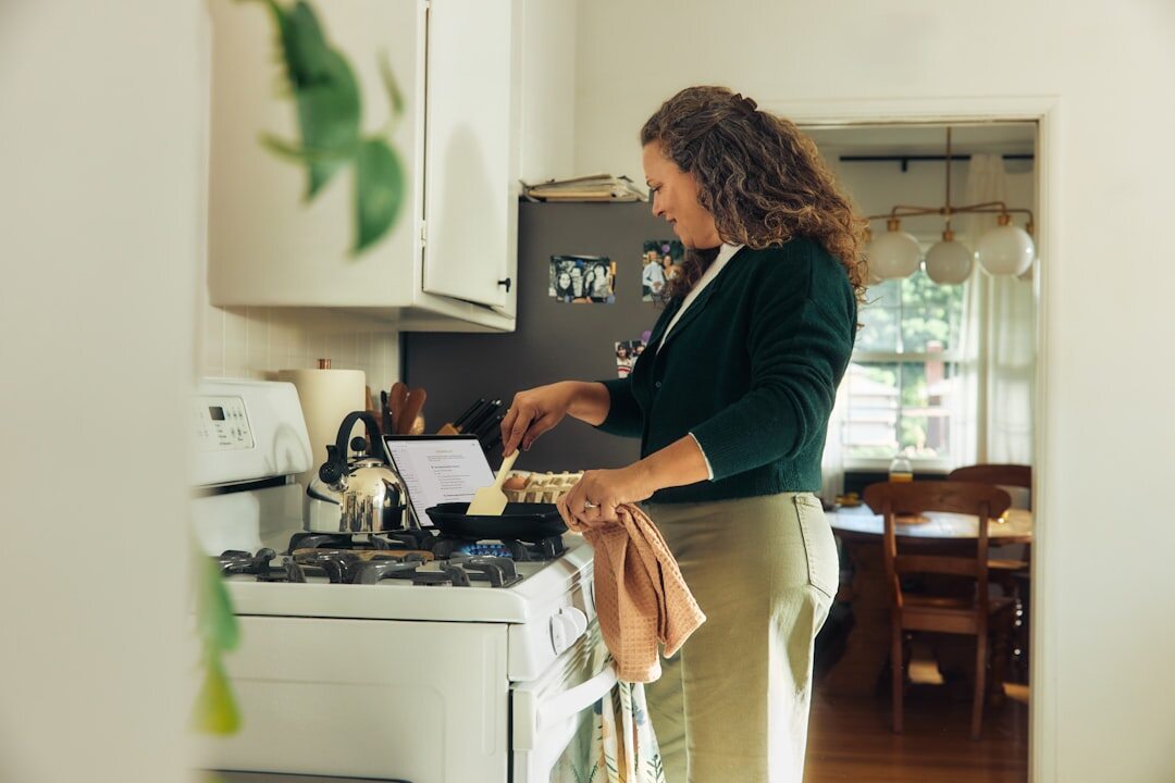 elderly woman cooking in kitchen