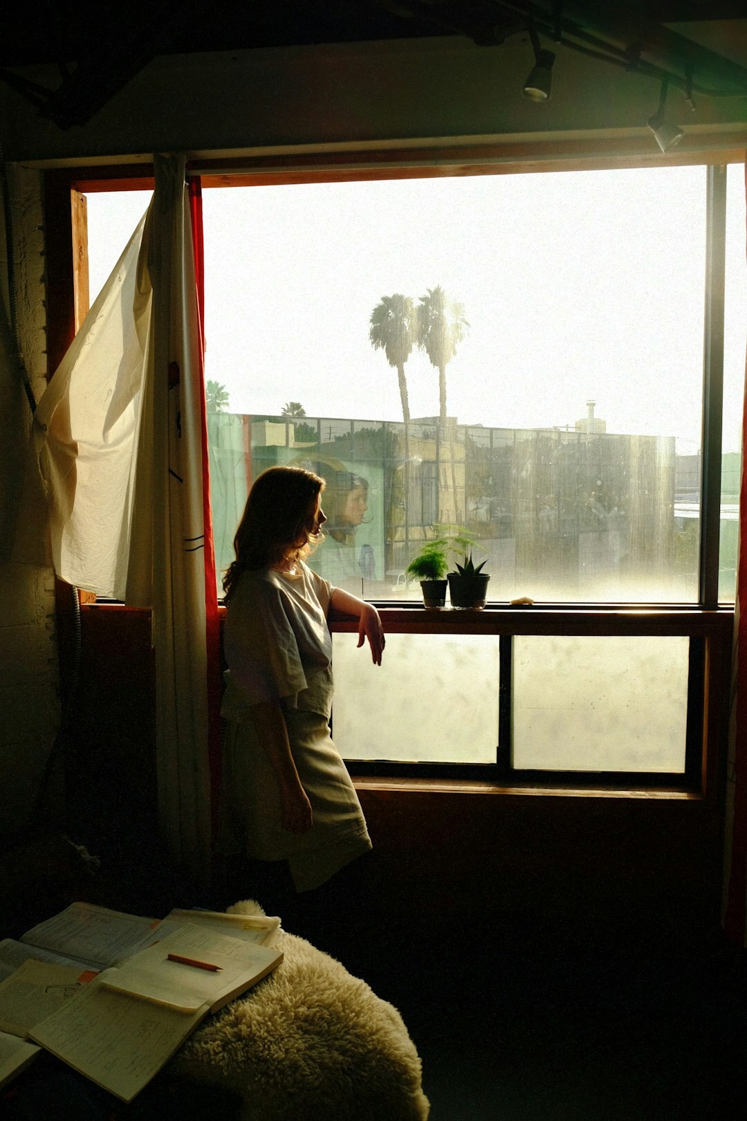 elderly woman in apartment window